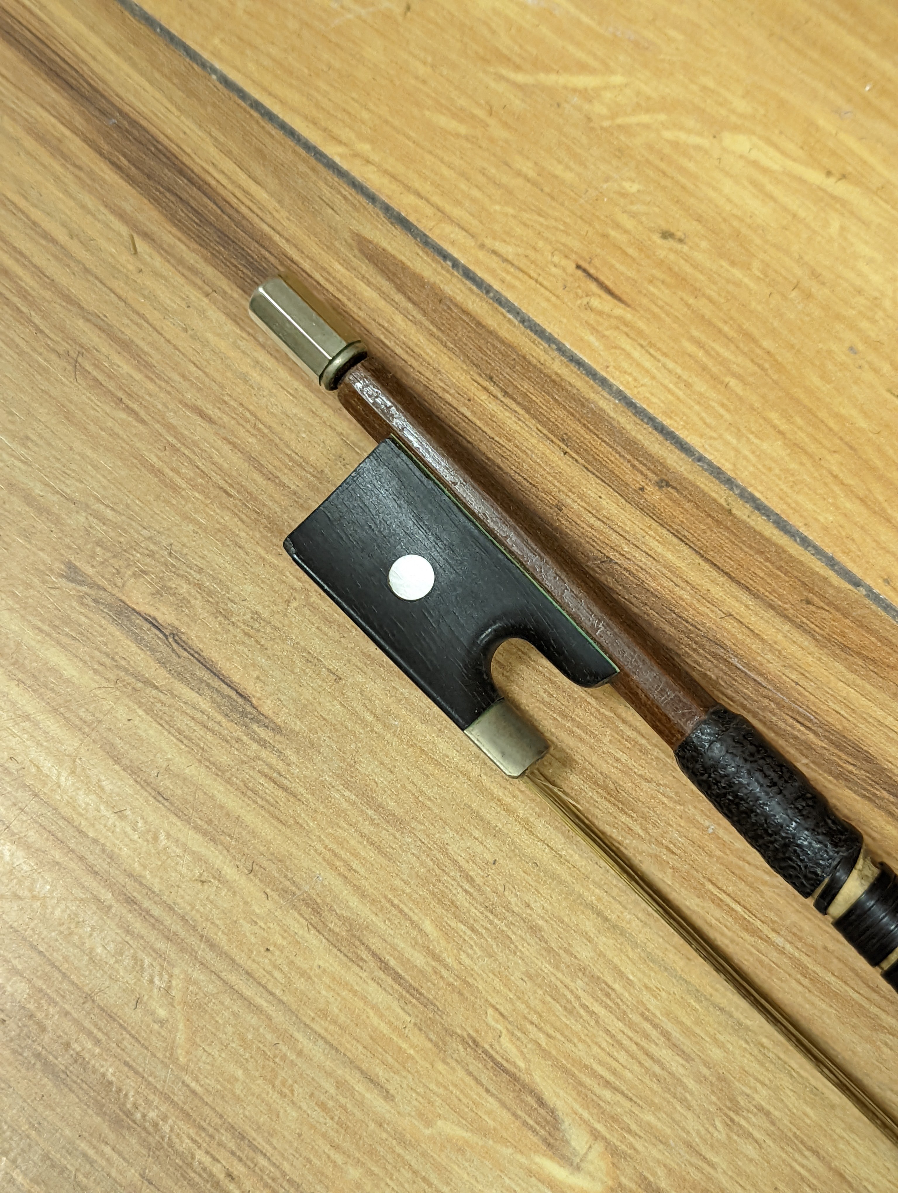 An early 20th century French vioilin, cased with bow and a cased saxon violin
